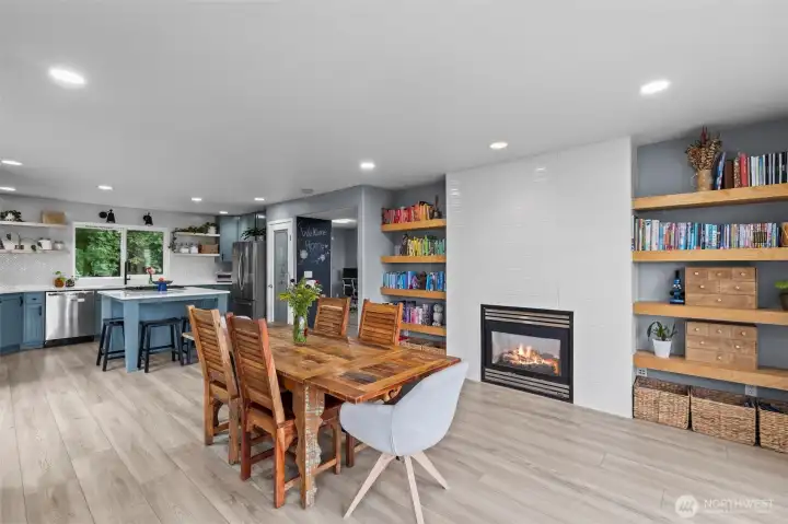 Built-in shelving flank the gas-fed fireplace. This room is versatile and can double as a sitting room.
