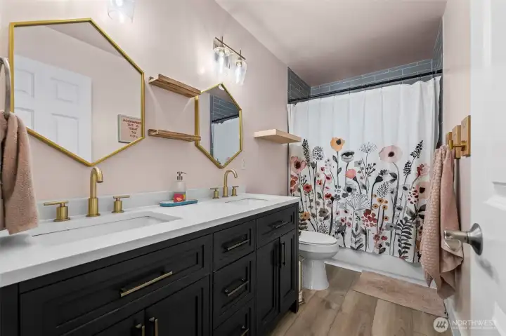 Updated bathroom upstairs has modern touches with everyday functionality.