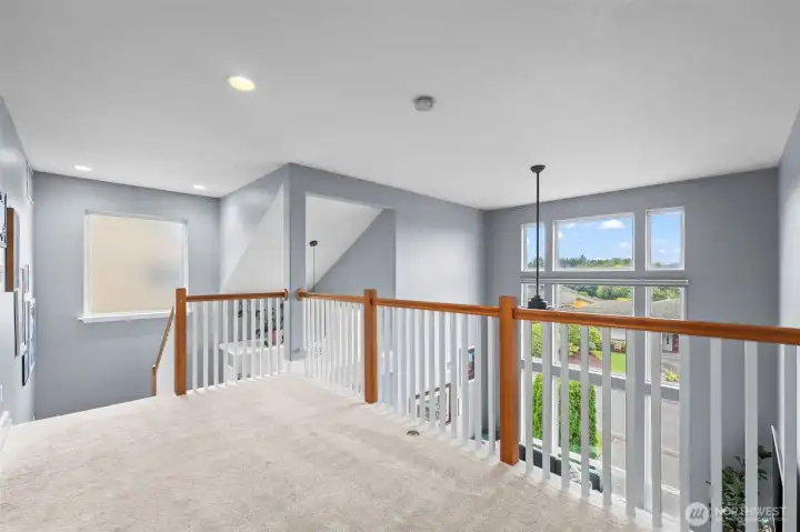 Upstairs loft hallway has additional space for hobbies.
