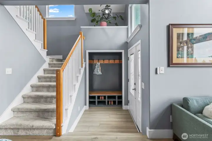 Front entrance has a custom bench with built-in storage.