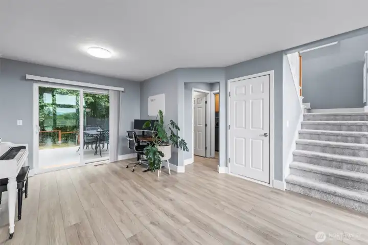 Additional space behind living room provides a versatile space. Closed door takes you down to the garage.