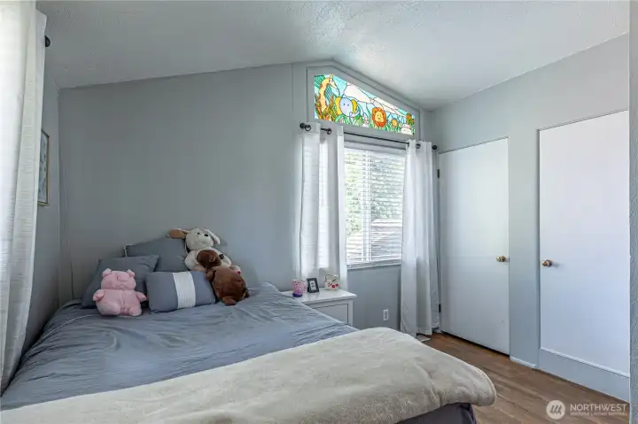 2nd upper bedroom is charming and light.