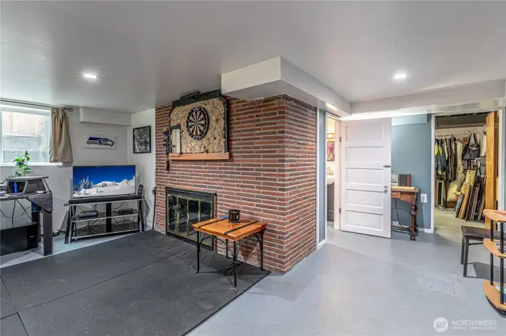 Lower-level 3rd bedroom features a fireplace and a half bathroom.