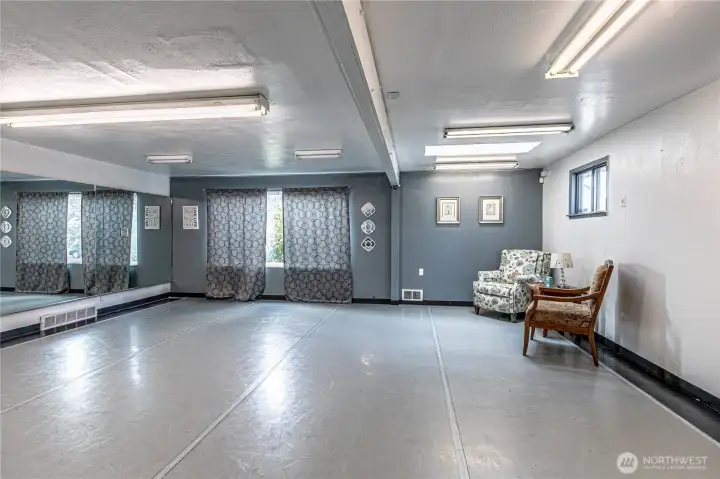 Large open space with windows and a heat source.