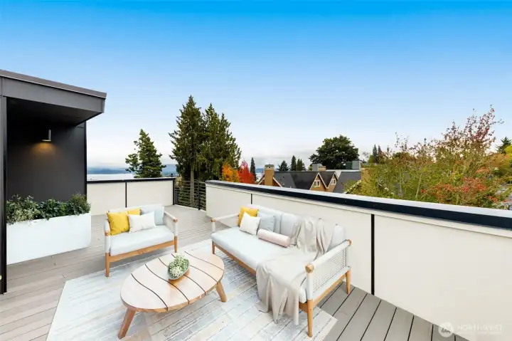 Top level features a private rooftop deck, sit atop Madrona & soak in the view. Entertain, or simply enjoy your sanctuary. This image is virtually staged.