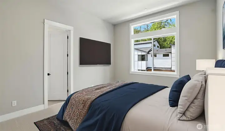 3rd of four bedrooms on the Upper Level. This bedroom shares a Jack-and-Jill Bathroom with the 4th Bedroom. Virtually staged.