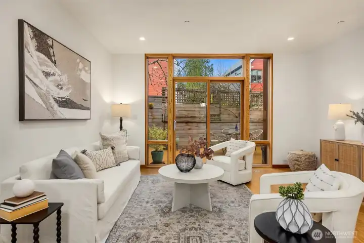 The living room adjoins a spacious, private, west-facing deck