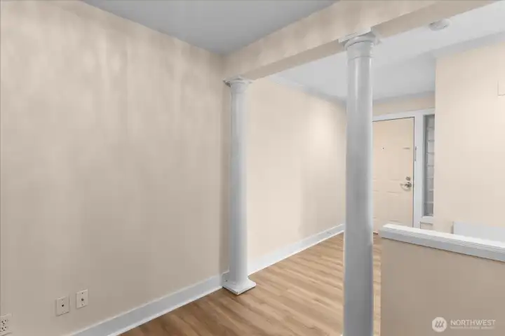 Looking toward entry door from office area.