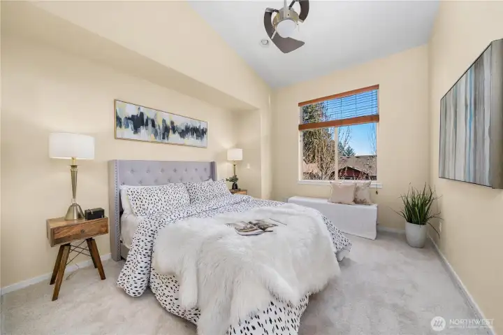 Primary Suite vaulted ceiling and designer fan.