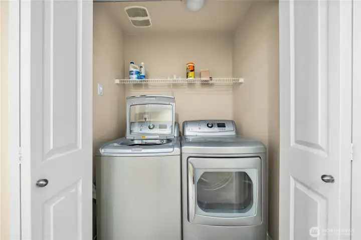 Laundry closet upstairs with bedrooms.