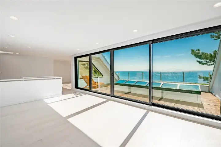 A wall of windows in main bedroom