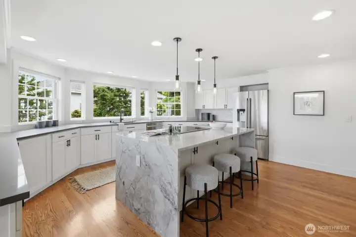 The waterfall Quartz is stunning. Hardwood floors flow into the kitchen space as well.
