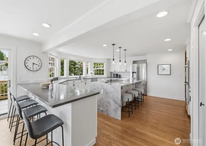 The additional eating bar is perfectly connected to the quaint nook and slider to the deck.