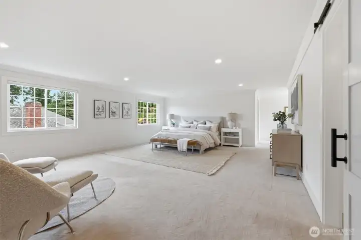 The primary suite is a haven: expansive, comfortable and sited privately on the east side of the home.