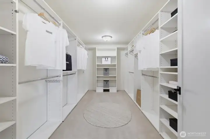 A view of the walk-in closet in the primary bedroom.