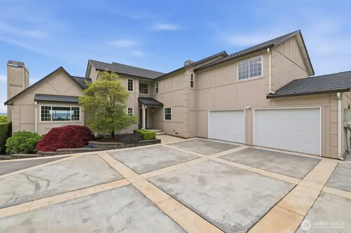 A handsome and stately residence. The two car garage and EV charger on the right of the garage are convenient.