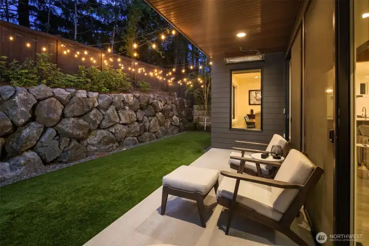 Covered patio with stone hardscape, extending the living space outdoors