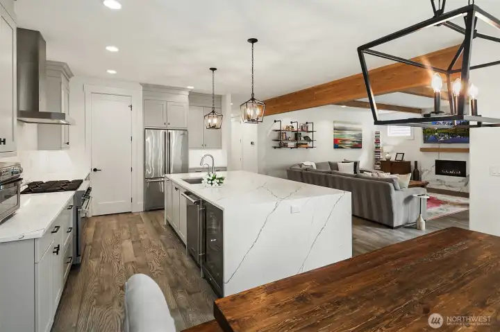 Sightline from the family room into the chef's kitchen