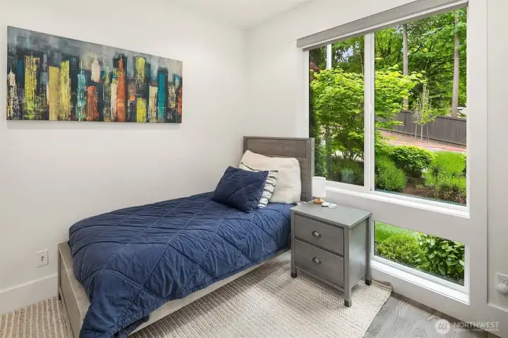 Bedroom with treetop views and oversized windows