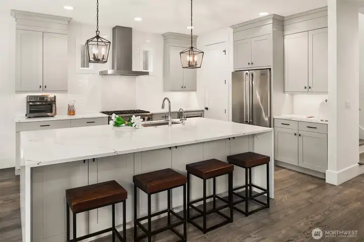 Professional-grade range with custom hood and quartz counters