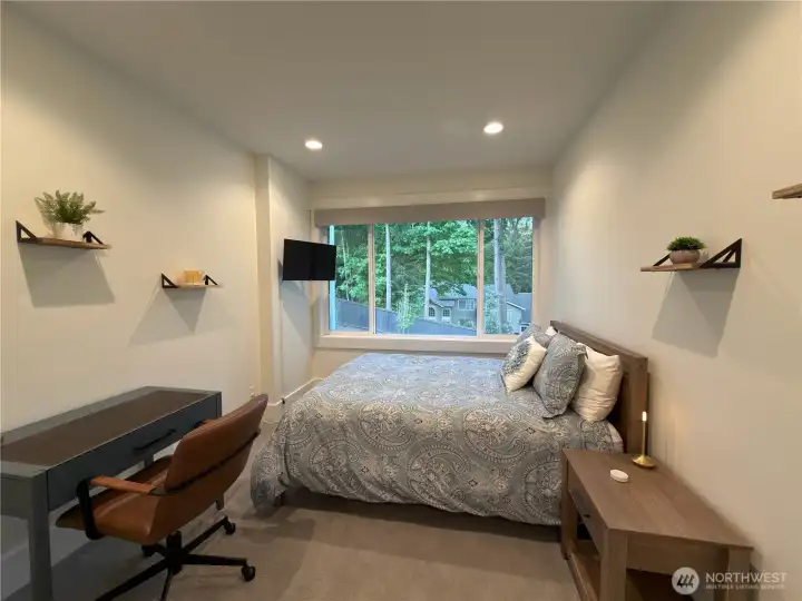 Secondary suite with private outlook to the garden