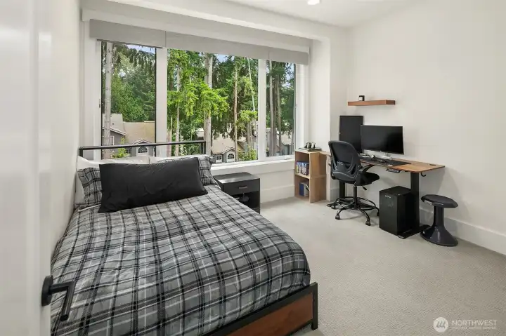 Bedroom configured with desk and window seat for a quiet study