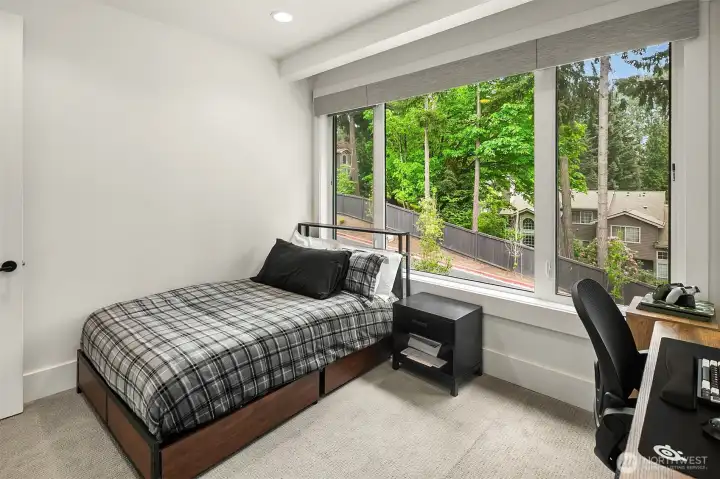 Bedroom with custom built-ins and exterior view