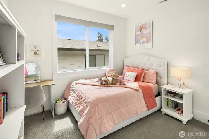 Bedroom with abundant natural light and built-in window seat