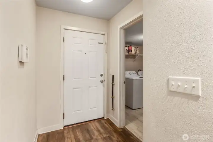 Large mudroom off entry way offers extra room for storage and easy laundry load switches!