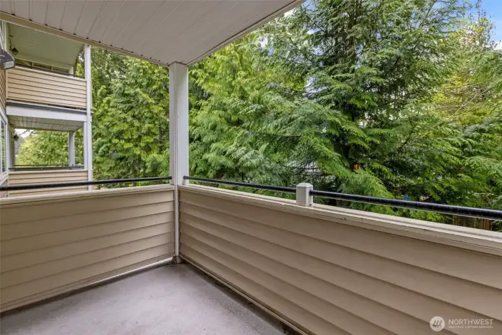 Private balcony situated next to trees for additional privacy