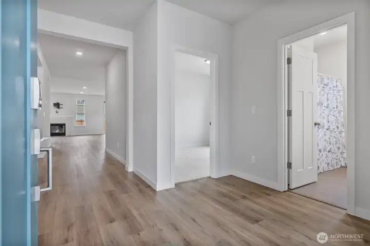 Gorgeous flooring, tall ceilings, and white millwork throughout