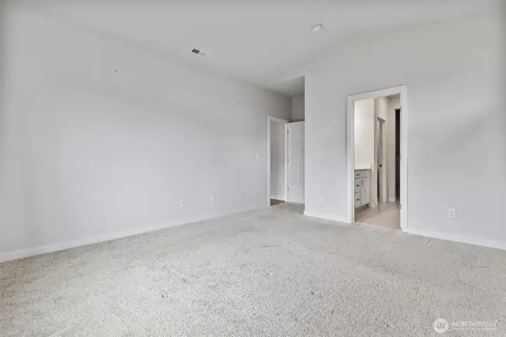 Primary Bedroom is separate from the two secondary bedrooms
