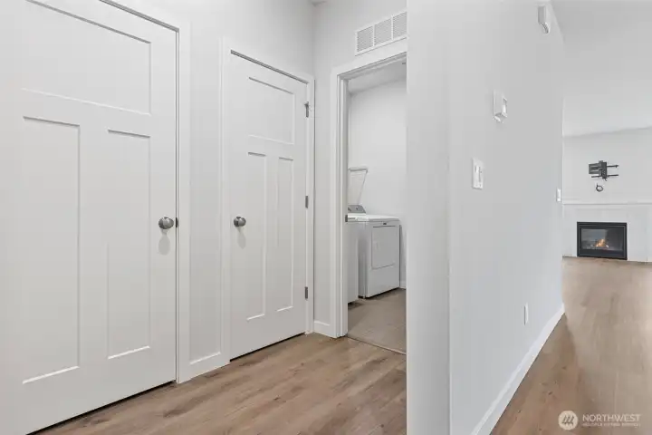 Small hallway to the furnace room, coat closet, and utility room