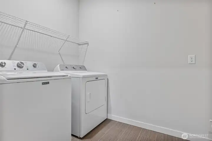 The Maytag washer and dryer remain - look closely on the right edge and you will see plumbing in place should you wish to add a utility sink
