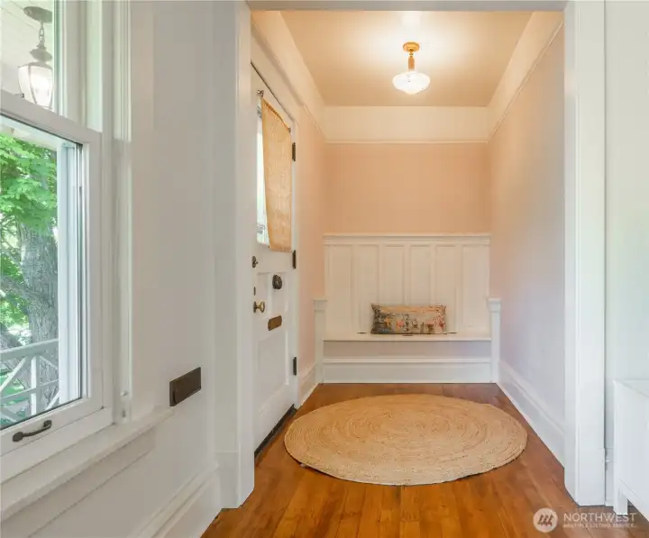 Entry with original bench and fir wood floors throughout
