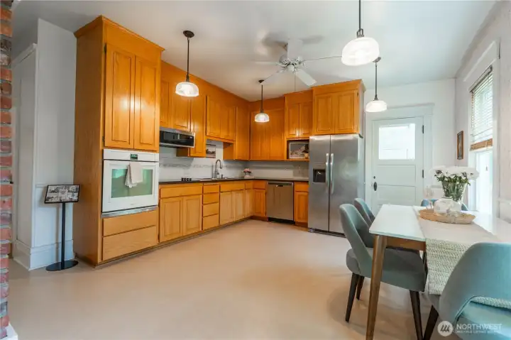 Back door leads to laundry/mudroom with half bathroom