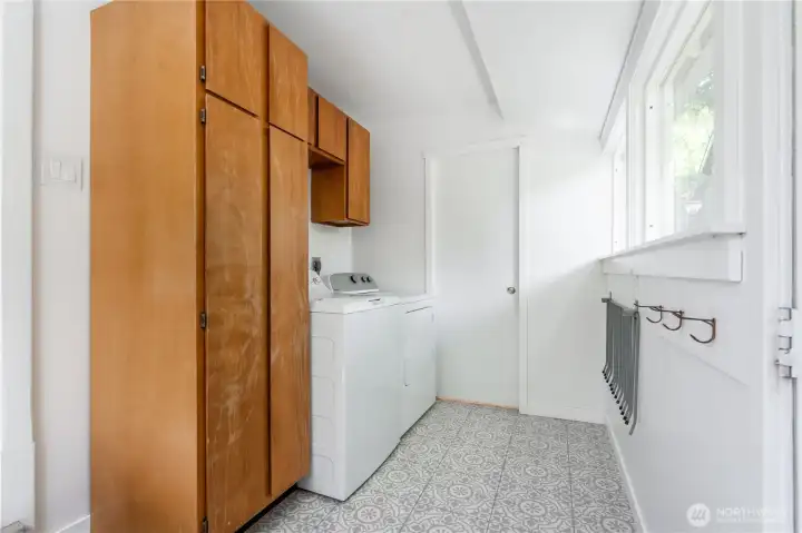 Laundry/mudroom. Pocket door hides half bathroom.