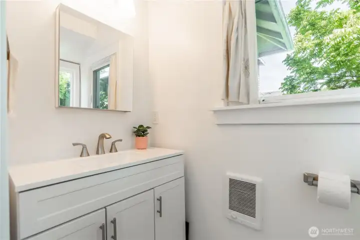 main level half bath off of mudroom/laundry