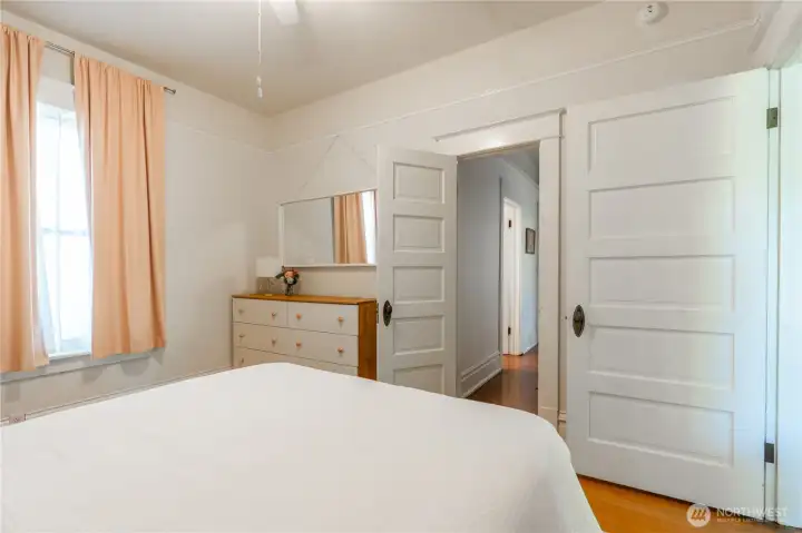 bedroom with hallway access to bathroom