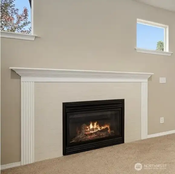 The current fireplace surround is easily removable. This what the tile looks like underneath The current fireplace surround is easily removable. This what the tile looks like underneath