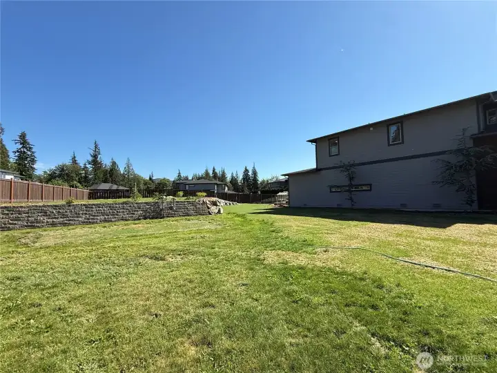 Giant side yard with elevated yard area!