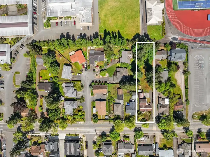 Measuring approximately 296' x 64', the property provides a substantial development footprint with efficient dimensions for future planning.