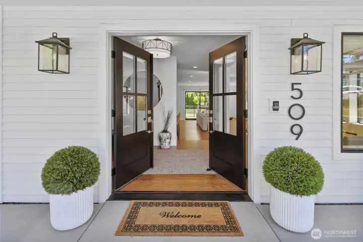 Grand double door entry into front mudroom area and foyer
