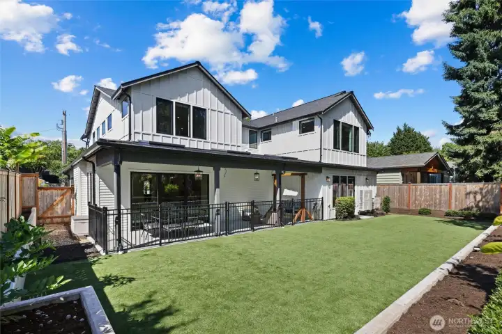 Backyard with covered entertaining patio and low maintenance turf, in-ground Rain Bird irrigation system
