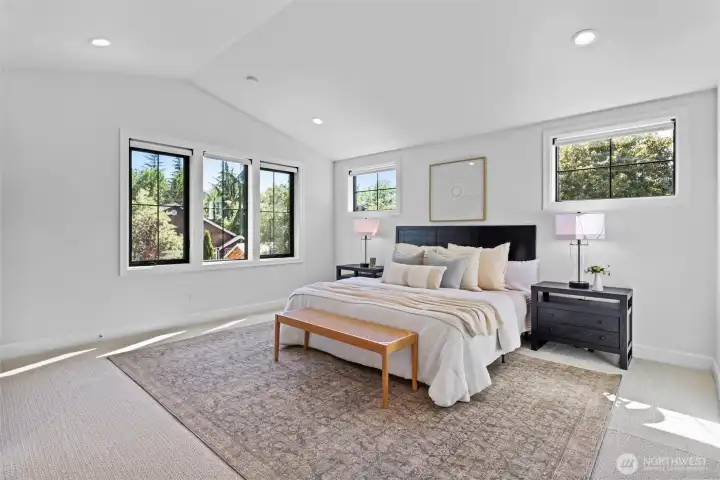 Bedroom #3 (West wing dual primary) with large 3/4 bath ensuite and vaulted ceilings