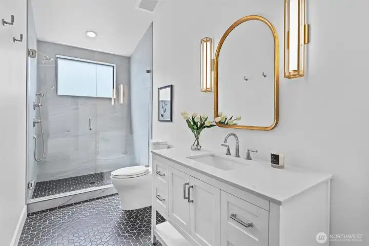 Ensuite 3/4 bathroom for Bedroom #3 with floor to ceiling tile shower