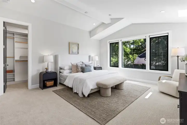 Primary Bedroom with vaulted ceilings and 5 piece spa inspired ensuite and walk in closet