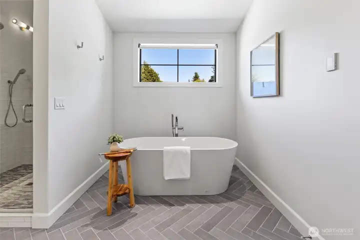 Large soaking tub in primary bathroom