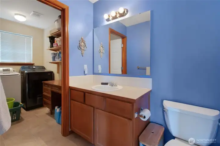 half bath leads into utility room