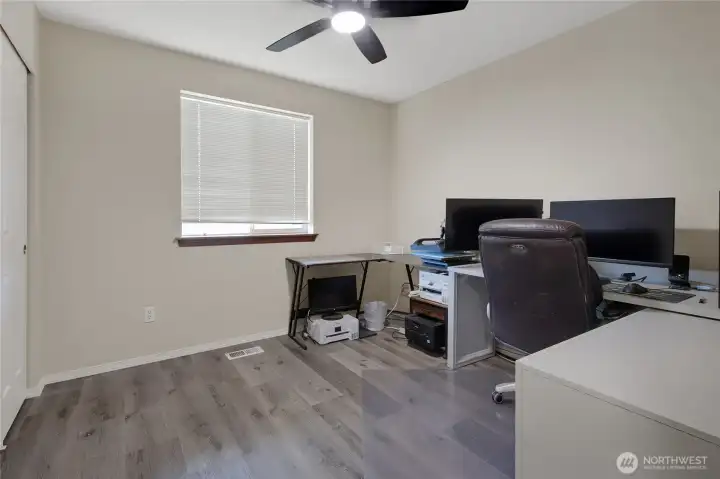 Another secondary bedroom, currently being used for an office. Can also be a bedroom ,quilting room, or?